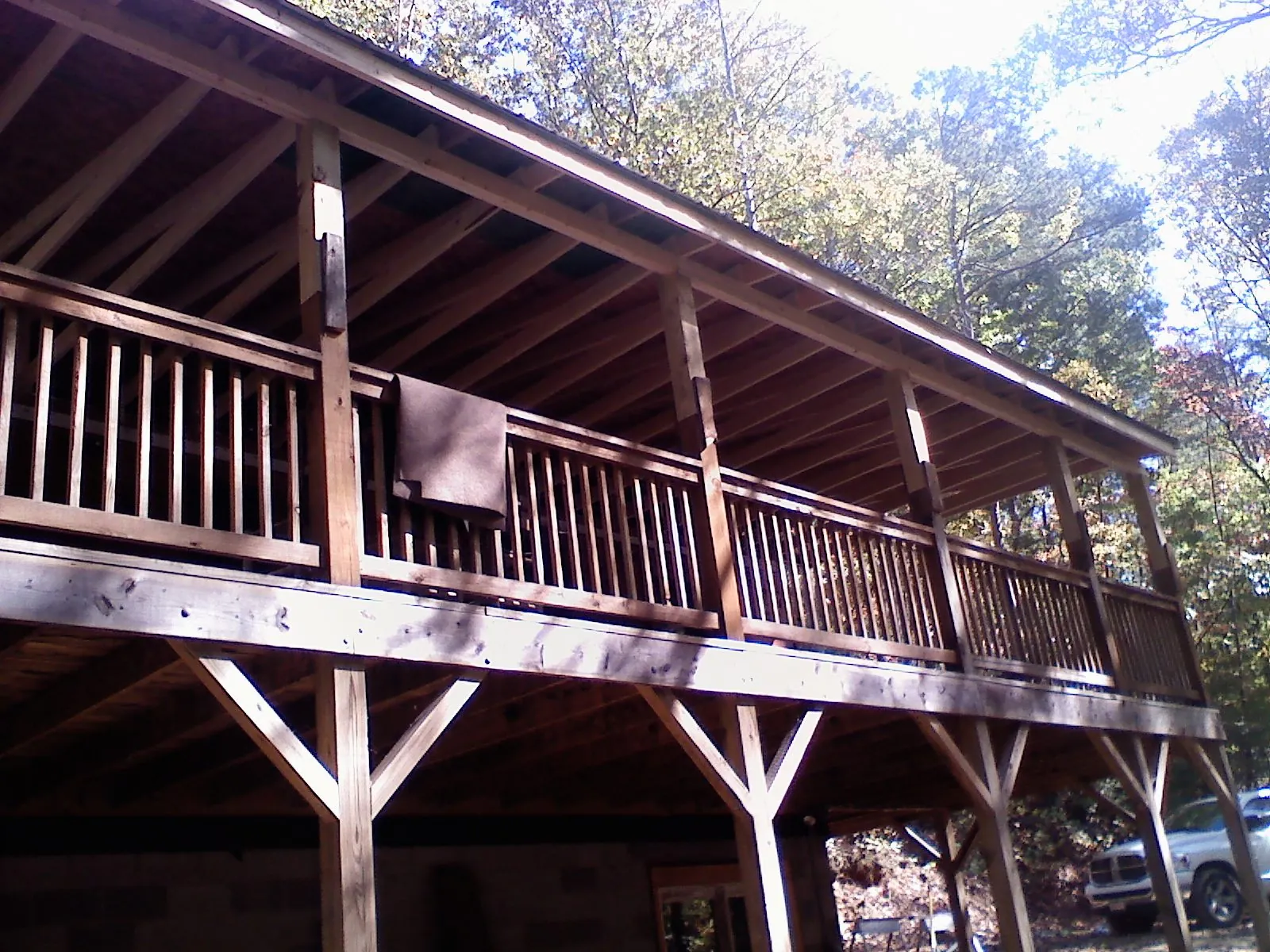 Timber framing under a new elevated porch and deck — Roof Leak Repair in South Weymouth by Roofing Brothers